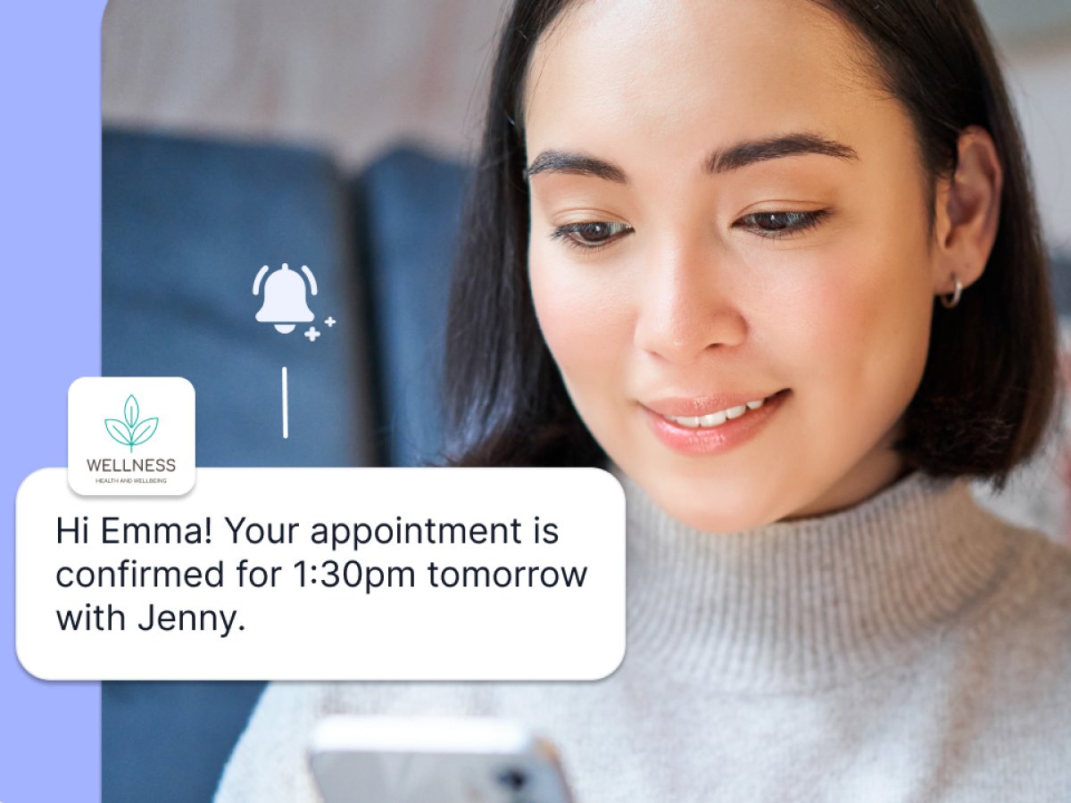 Client receiving an SMS appointment confirmation on her phone